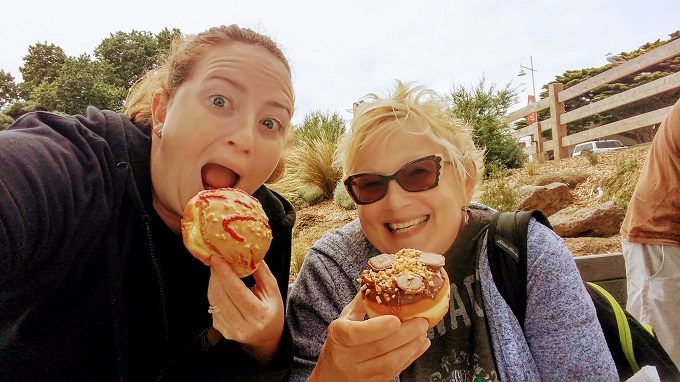 Shae and mom eating Daniel's Donuts