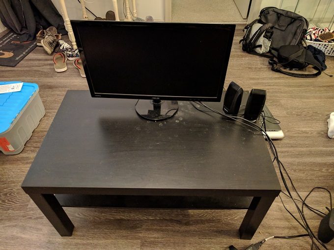 Coffee table, monitor and speakers