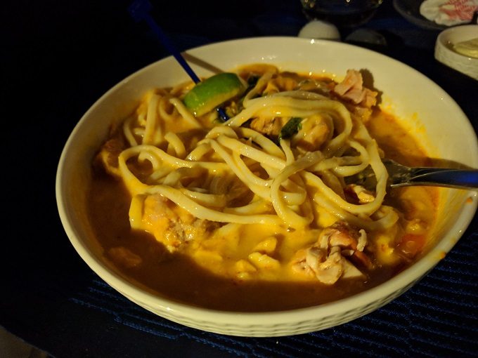 United Polaris entree - spicy chicken with udon noodles