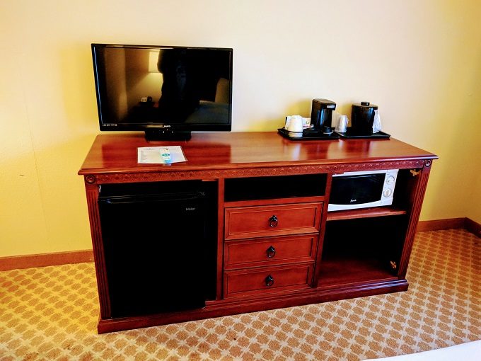 Country Inn & Suites Saraland, Alabama - Dresser with TV, microwave, fridge & coffee maker