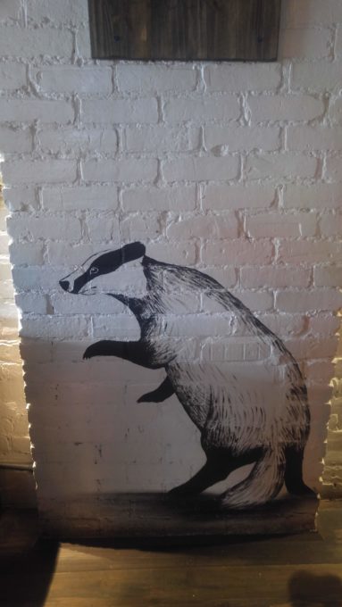 Hufflepuff Badger on wall at Lockhart Bar, Montreal