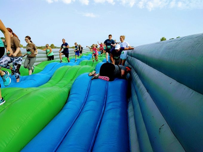 Insane Inflatable 5k Grand Rapids MI - Shae stacking it on obstacle 3