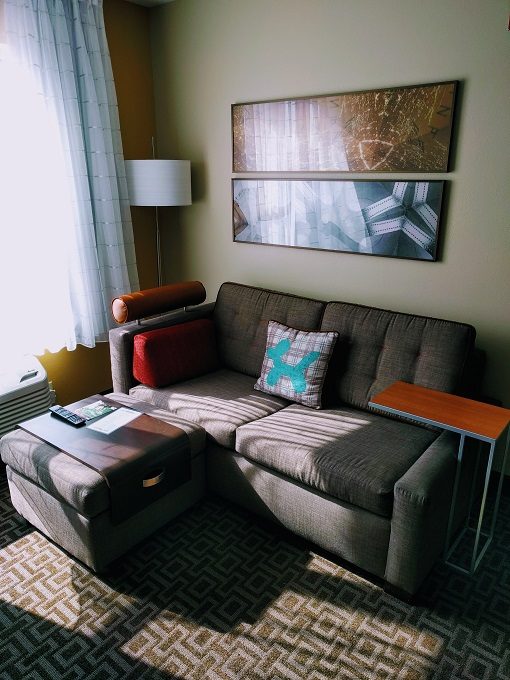 TownePlace Suites Chicago Naperville, Illinois - Sleeper sofa, ottoman & side table