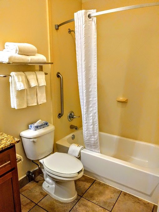 Candlewood Suites Abilene, Texas - Toilet and bathtub with shower