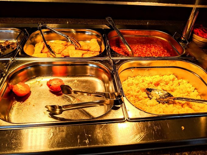Comfort Inn Arundel, UK breakfast - Hash browns, baked beans, tomatoes & scrambled eggs