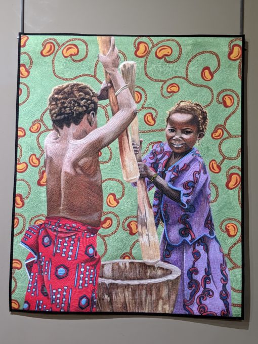 Pounding Millet by Hollis Chatelain at the National Quilt Museum