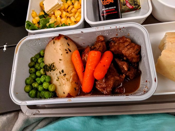 Cathay Pacific CX869 Washington Dulles to Hong Kong - Peppercorn braised beef, carrots, peas & parsley red bliss potatoes