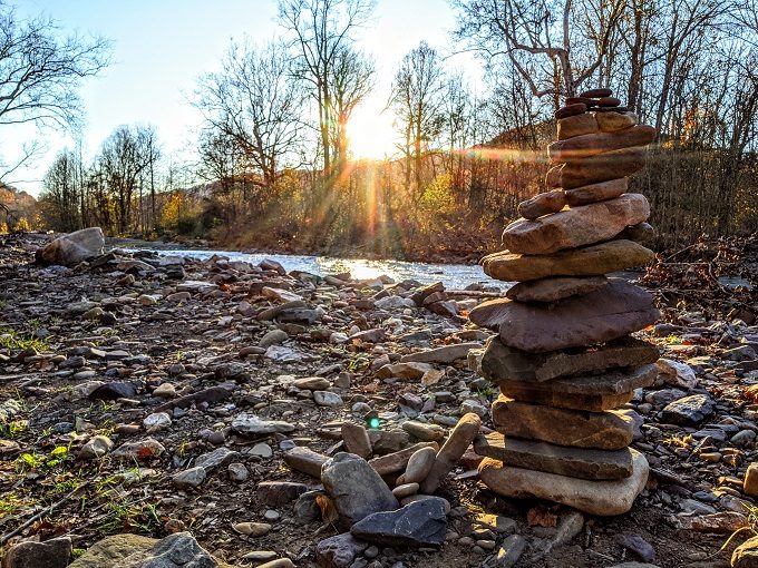 Rocks stacked by the stream