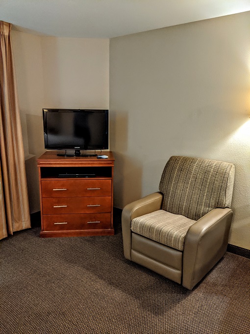 Candlewood Suites Lafayette, Louisiana - Reclining armchair, dresser & TV
