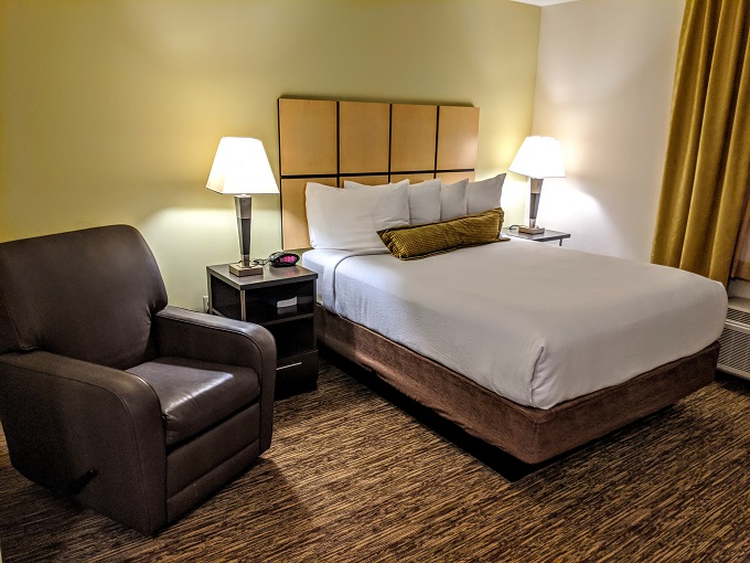 Candlewood Suites Lake Charles South, Louisiana - Queen bed & armchair
