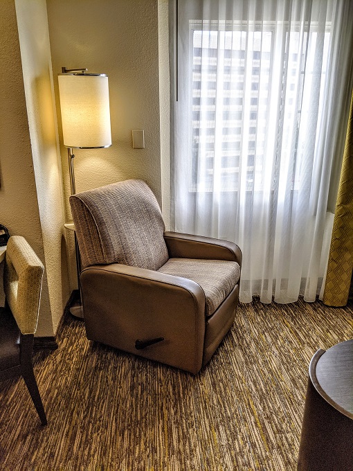 Candlewood Suites Virginia Beach Town Center - Armchair & lamp with shelf