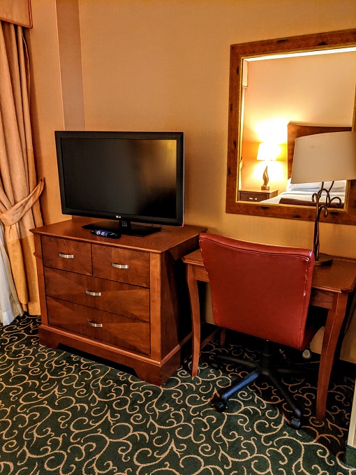 Embassy Suites Hampton Convention Center, VA - Desk, dresser & TV in bedroom