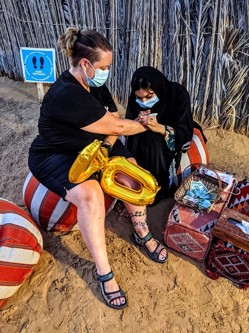 OceanAir Travels Desert Safari - Shae getting a henna tattoo