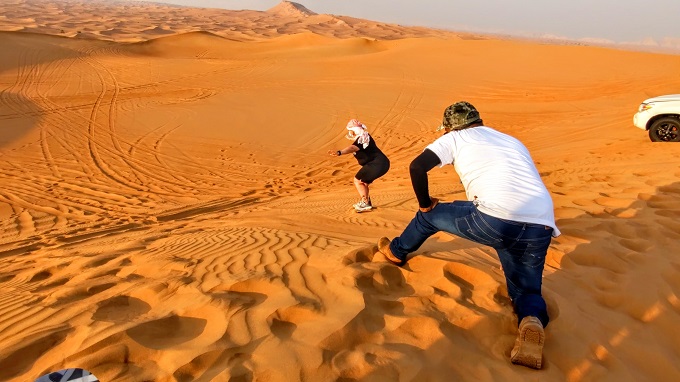OceanAir Travels Desert Safari - Shae sand boarding