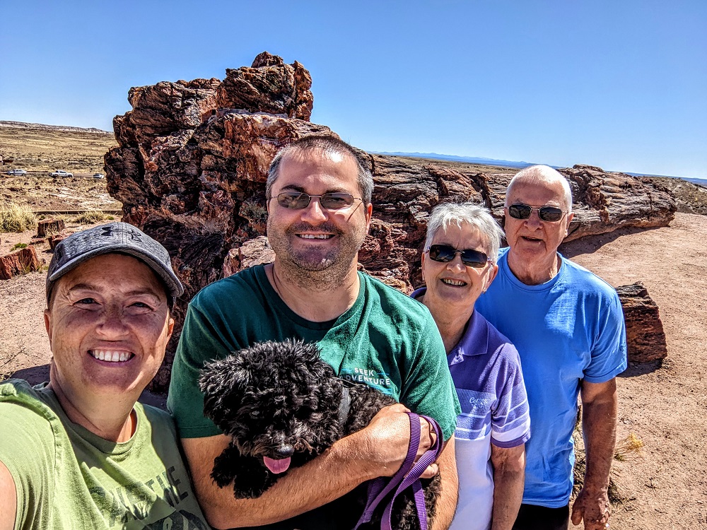 The five of us in front of the largest log at Petrified Forest National Park