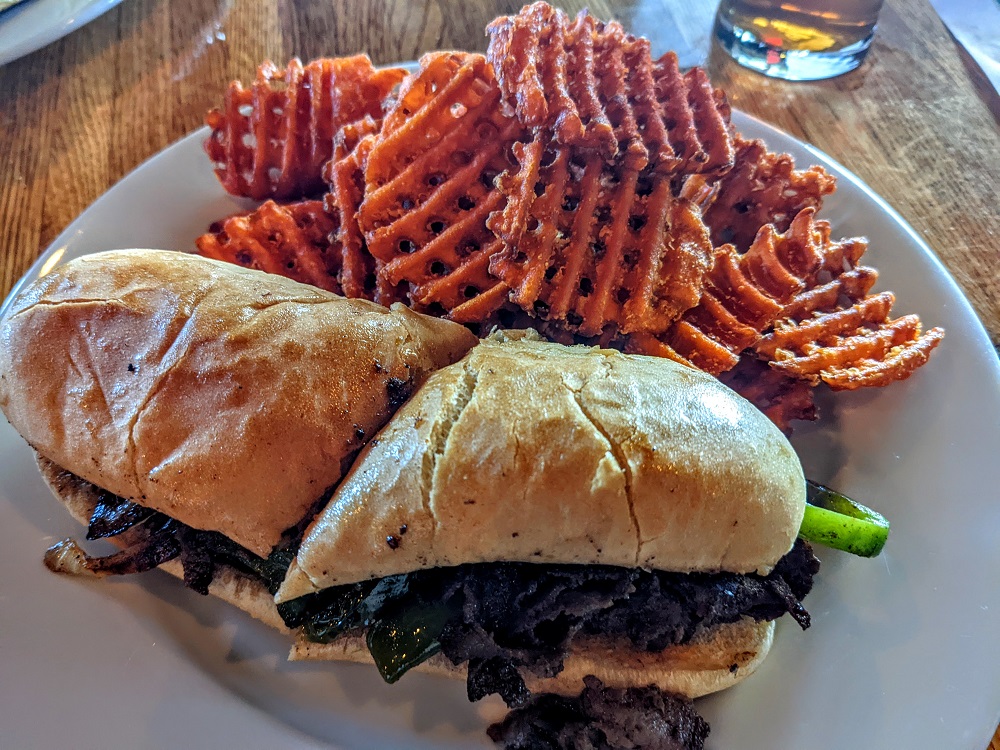 Kinkaider Brewing Co - Sandhills Philly with sweet potato waffle fries