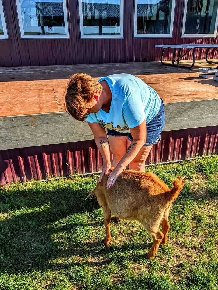 Shae petting one of the goats
