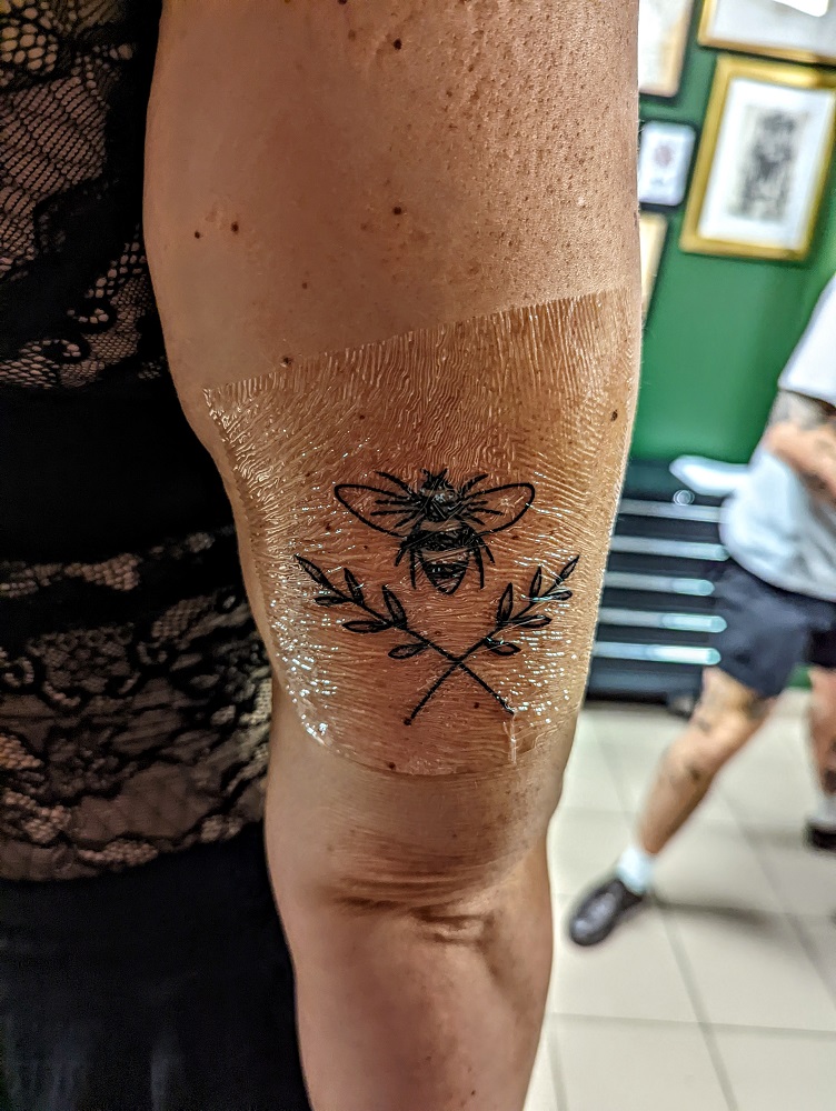 Megan's bee tattoo