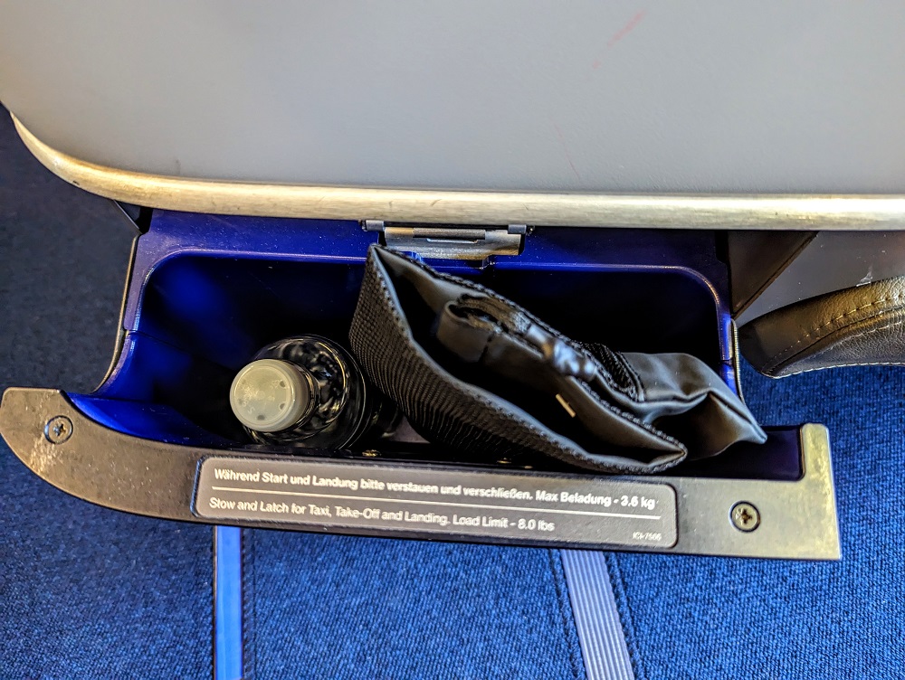 Lufthansa business class DFW-FRA - Cubby hole with water & amenity kit