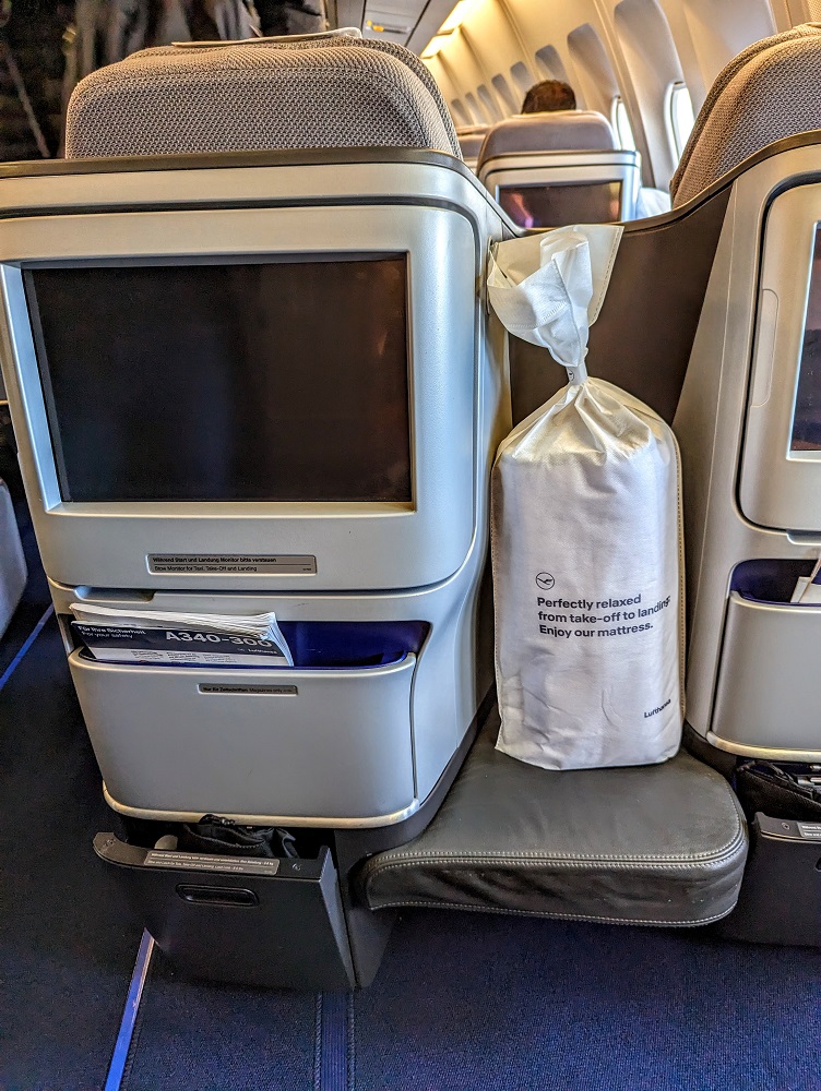 Lufthansa business class DFW-FRA - In-flight entertainment screen, footwell & mattress pad