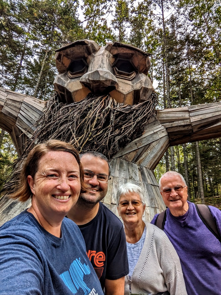 The four of us with Birk - Thomas Dambo troll at Coastal Maine Botanical Gardens Guardians of the Seeds