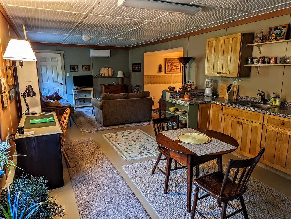Kitchen and living room (with bedroom ahead to the right) of our Airbnb in Conway, MA