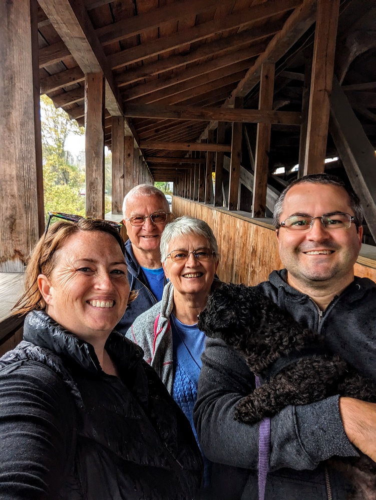 The four of us (and Truffles) staying dry in the walkway