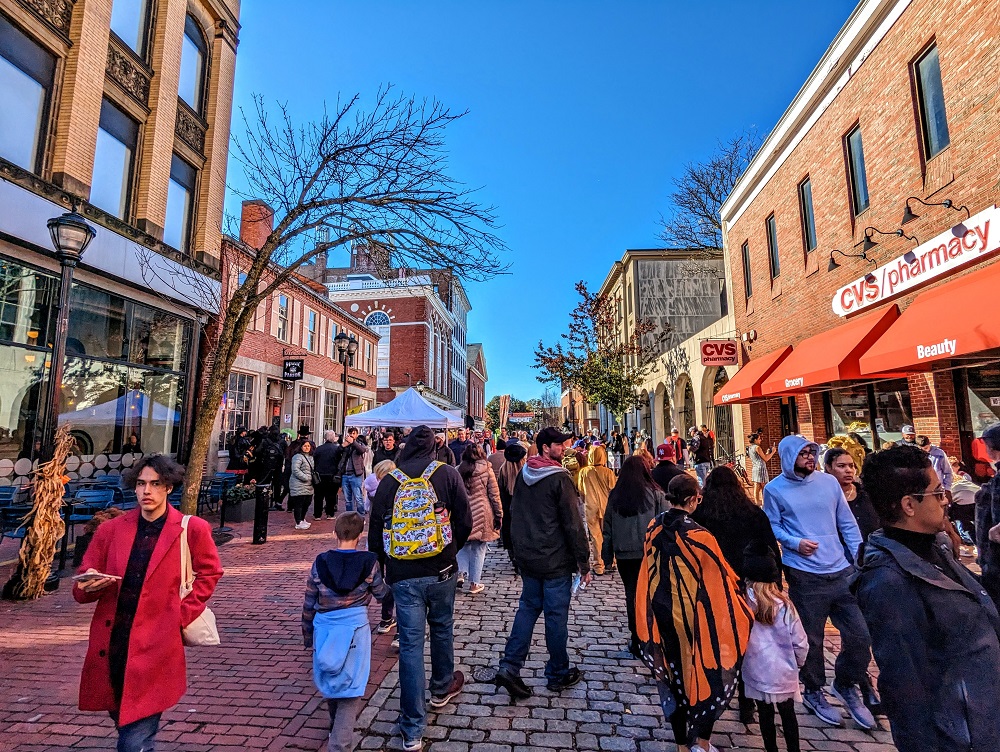 Crowds on Essex St Pedestrian Mall in Salem, MA during the day on Halloween