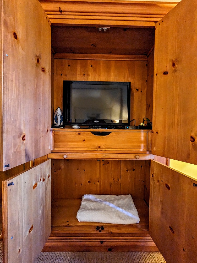 New Harmony Inn Resort & Conference Center - Cabinet with TV, iron & blanket
