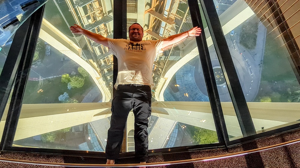 Me laying on the Space Needle's glass floor