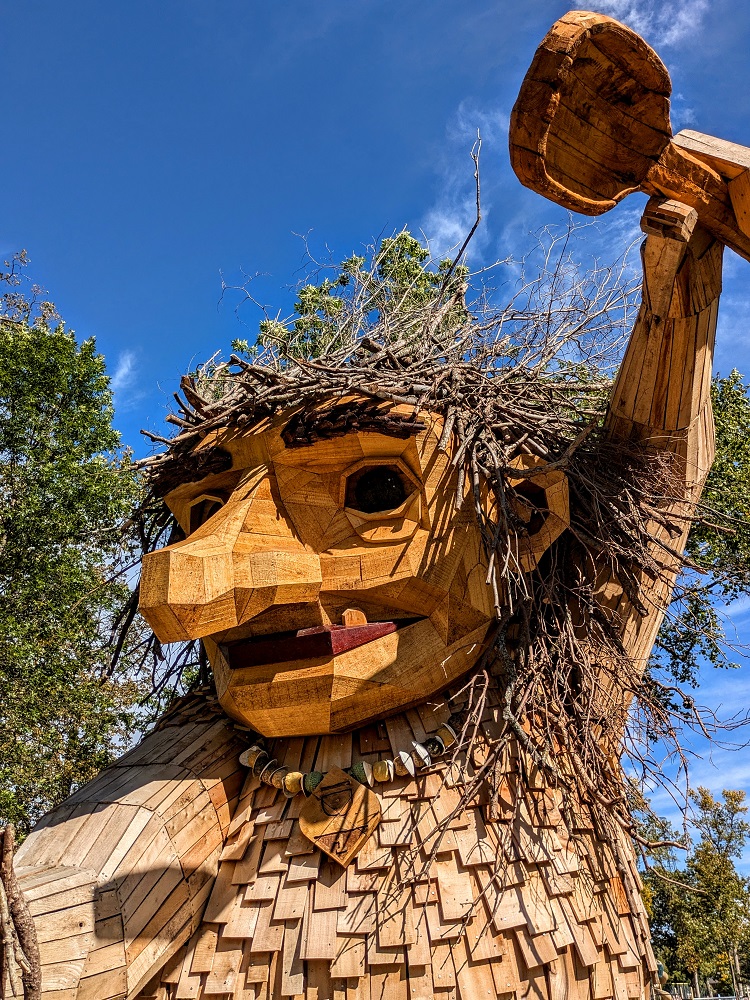 Thomas Dambo Detroit Lakes trolls - Alexa's looking like she's ready to dish out some trouble, but she's really just dishing out some bird house elixir