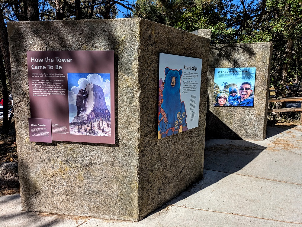 Devils Tower information boards mounted to rock from Devils Tower