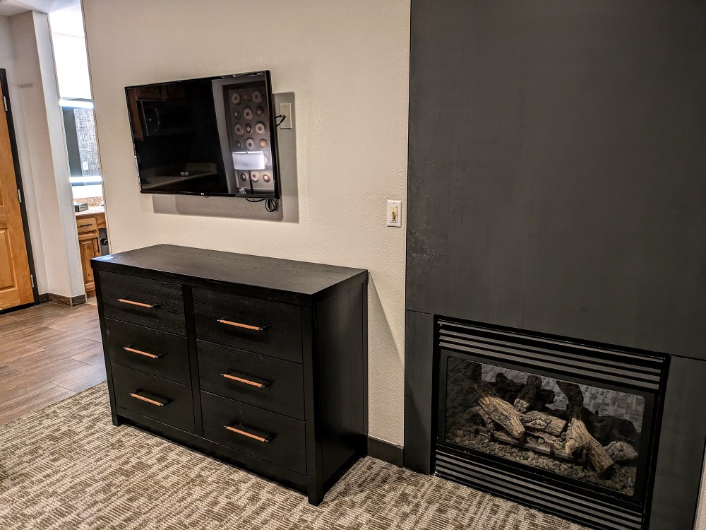 Homewood Suites Jackson, WY - TV, dresser & fireplace