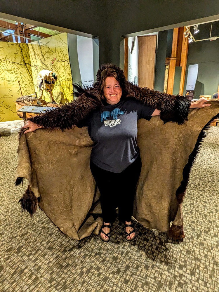 Shae trying on a buffalo hide