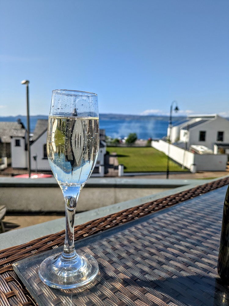 Enjoying a glass of prosecco in Mallaig