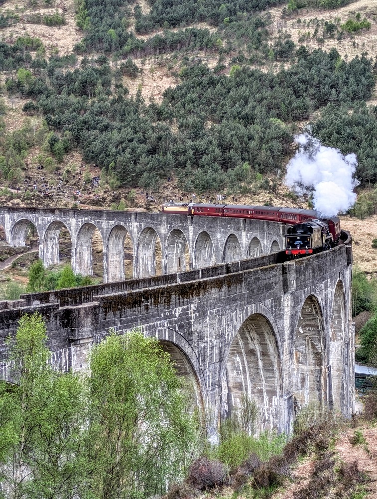 Jacobite steam train on the Glenfinnan Viaduct near Fort William, Scotland
